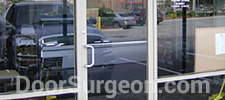 Commercial glass-aluminum storefront door Acheson.