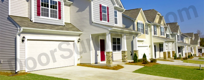 subdivision with homes showing garage doors on the front.