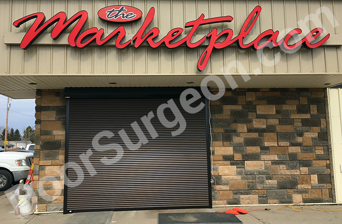 Roll shutter protection installed on The Marketplace store in the extended position Calgary