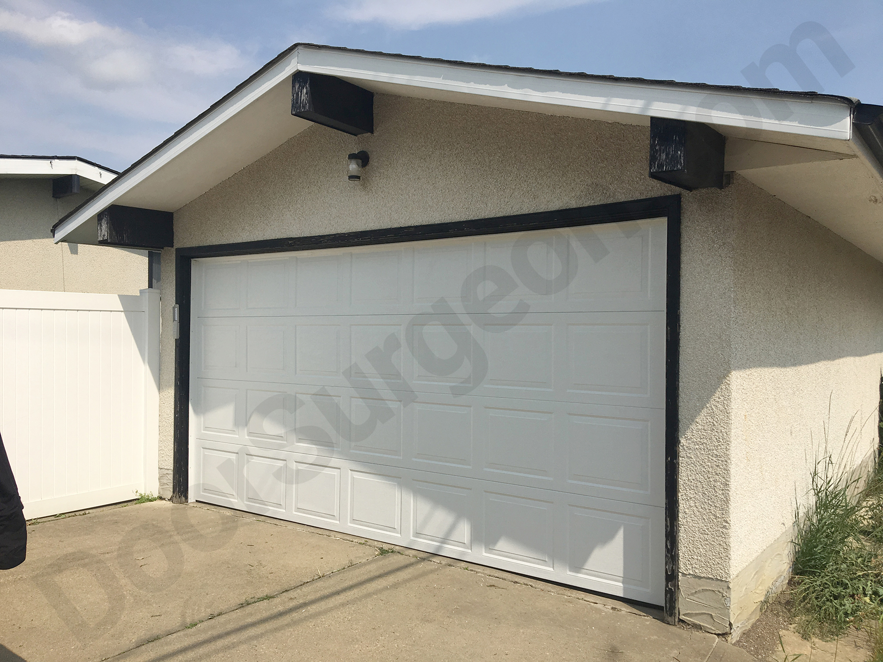 New garage door panels track rollers springs hinges weatherstrip installations in South Edmonton.