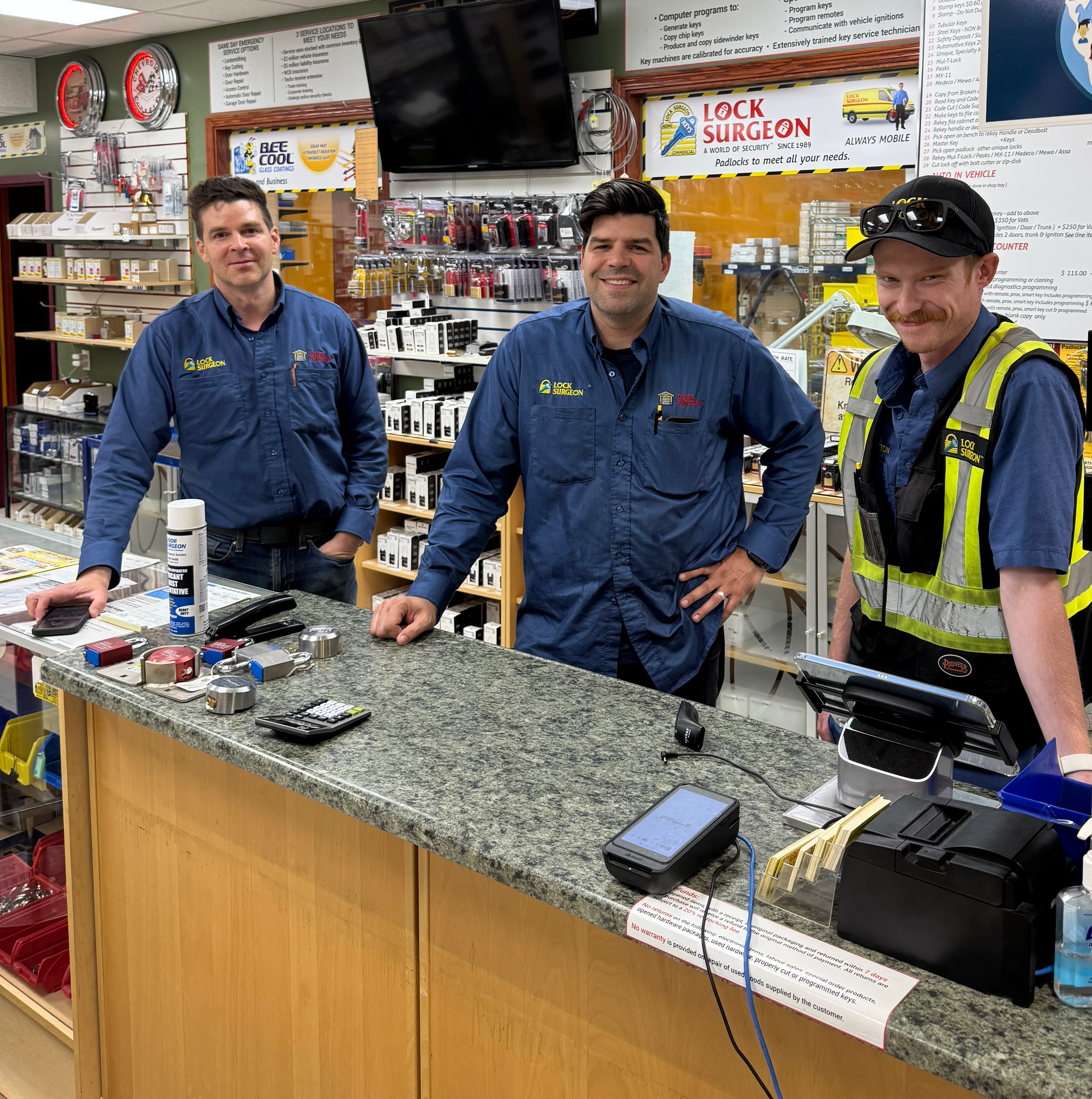 Patrick, Paul and Lucas at the Lock Surgeon shop service counter