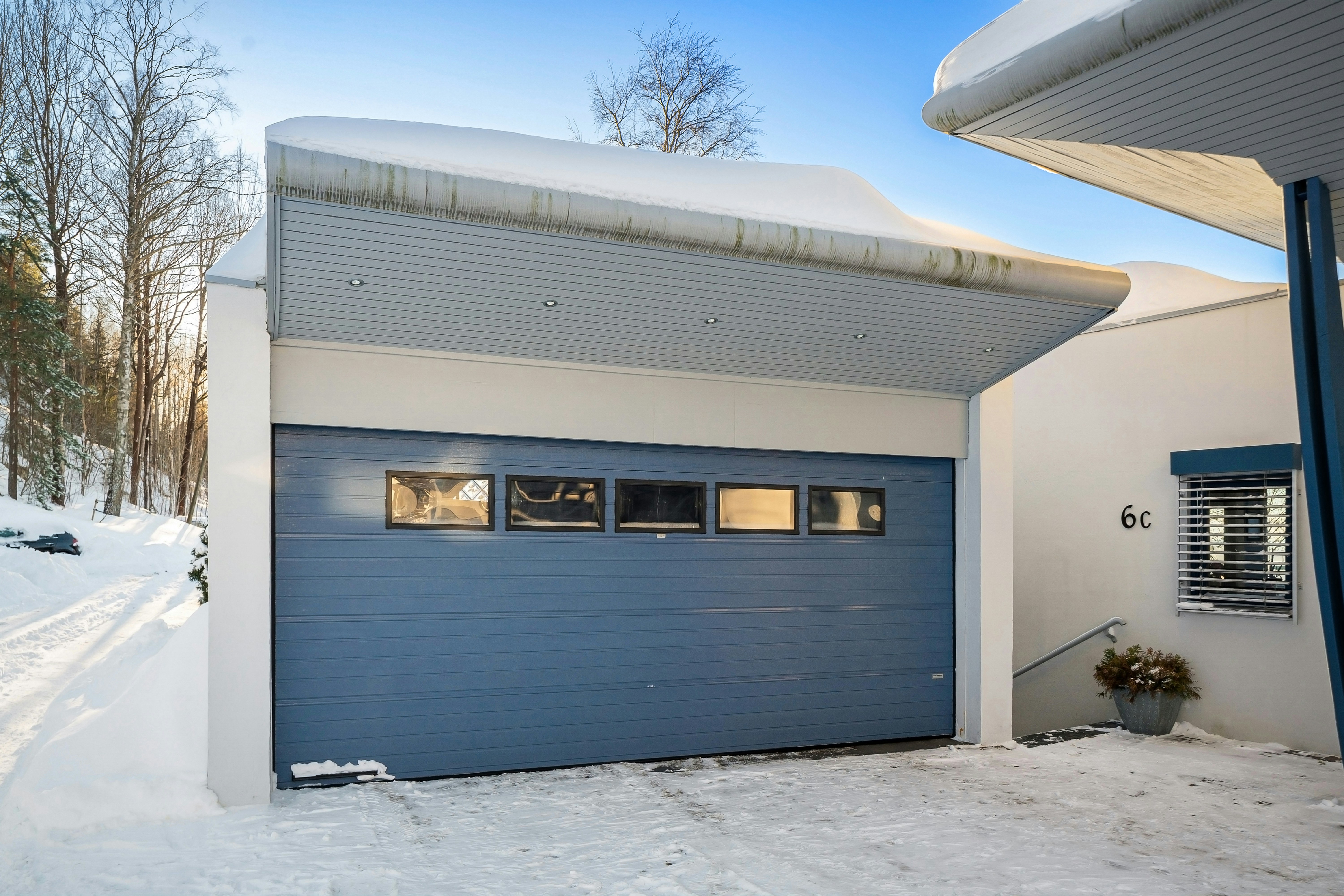 Residential garage doors and automatic openers inside an Calgary garage